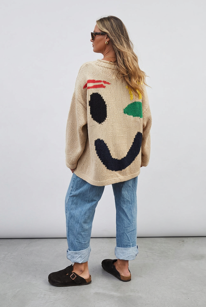 Beige smiley jumper back studio view
