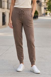 Brown joggers on sidewalk