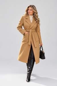 Camel coat walking pose in studio