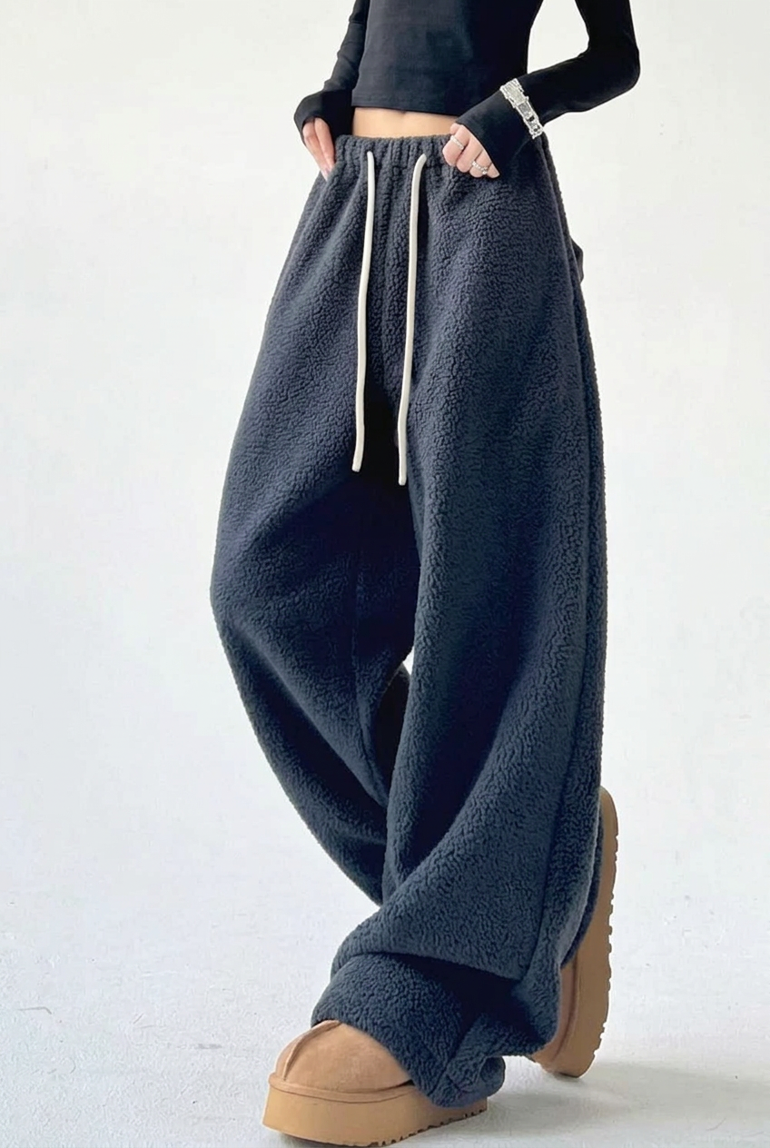 Charcoal trousers crossed-leg studio preview