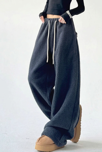 Charcoal trousers crossed-leg studio preview