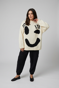 Cream and black smiley jumper studio preview