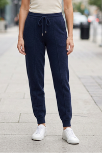 Dark blue joggers on sidewalk