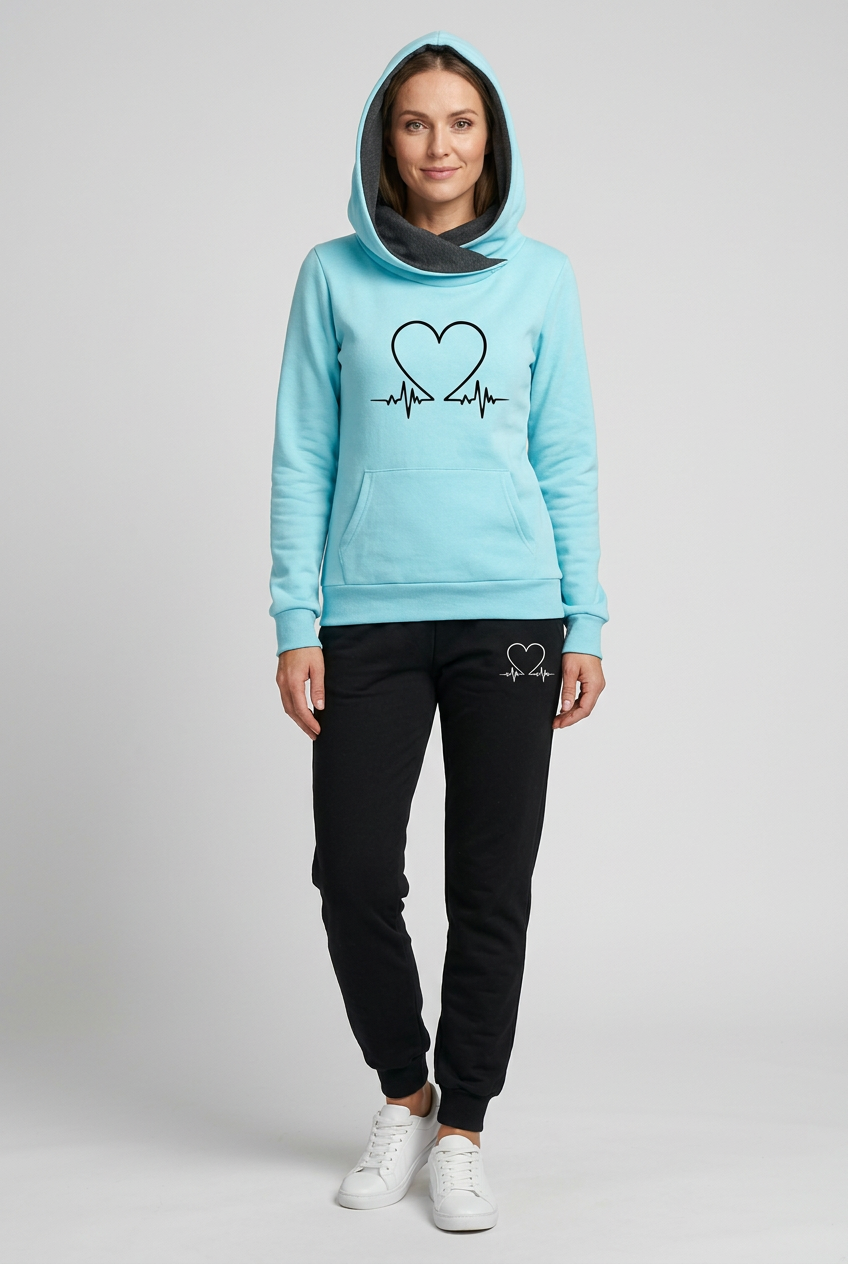 European woman wearing Aliya’s light-blue hoodie and black joggers