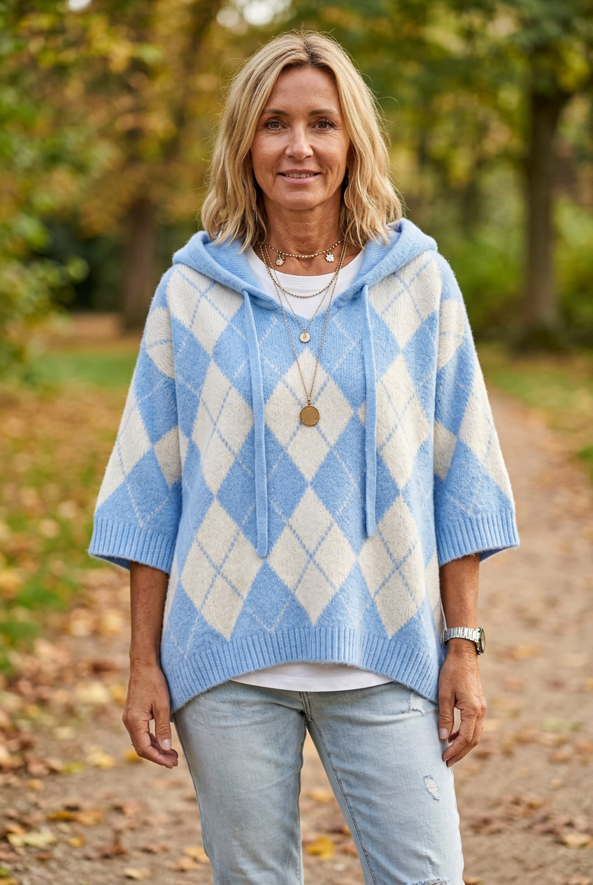 European woman wearing the light blue Winnie argyle jumper outdoors