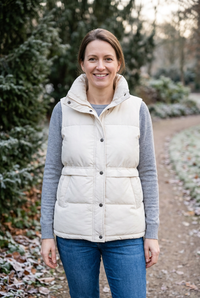 European woman wearing the white Etta vest outdoors