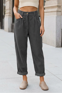 Gray trousers on a sidewalk