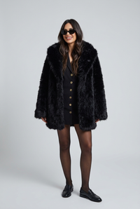 Kalyn black coat with sunglasses studio preview