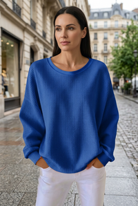 Royal blue sweatshirt sidewalk portrait