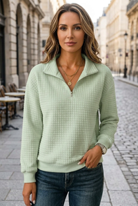 Sage green sweatshirt sidewalk portrait